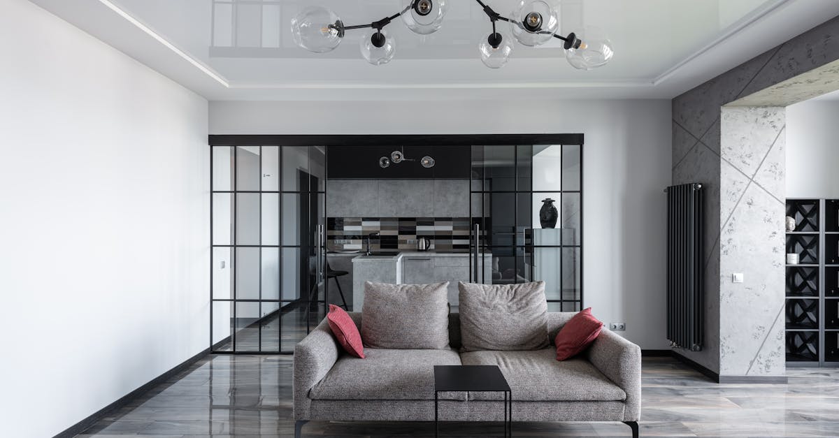 Elegant living room featuring a sleek grey sofa and contemporary design elements.